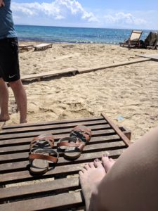 Sandals on a Greek beach