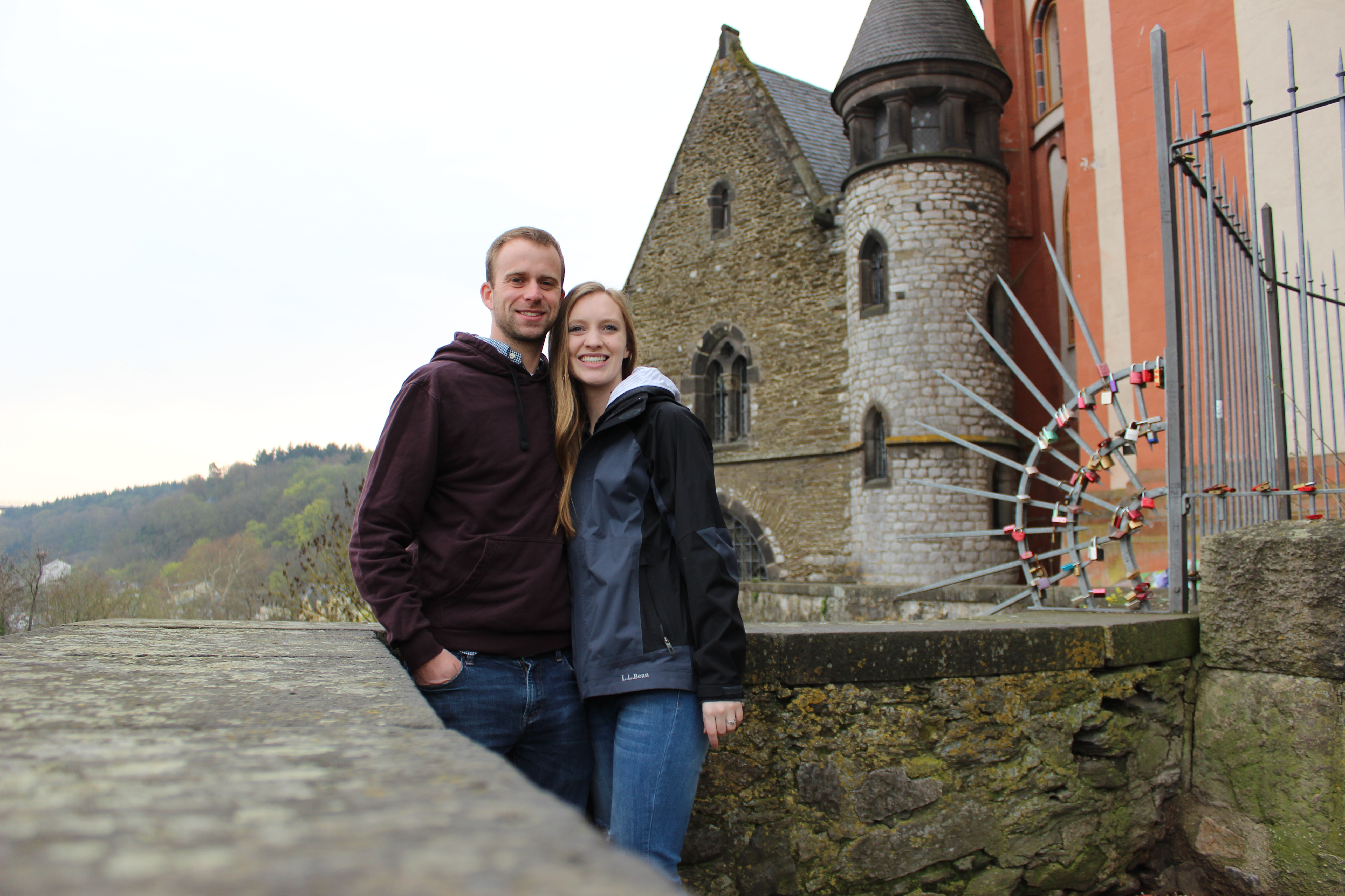 Couple standing in front of German castle