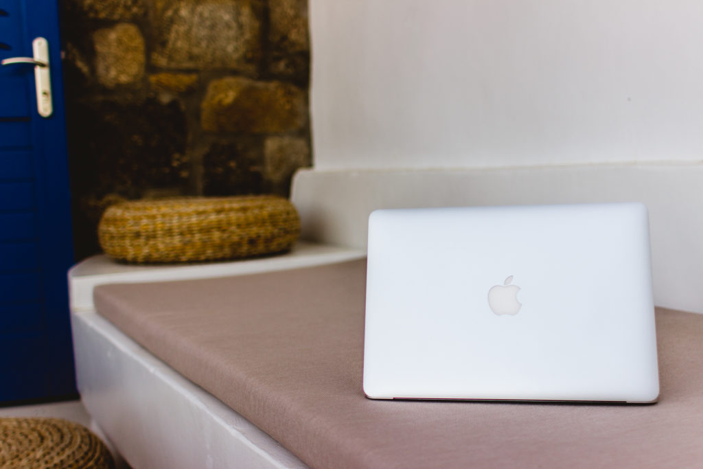 Mac laptop on a Greek bench
